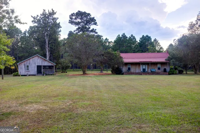 a front view of a house with a garden and porch