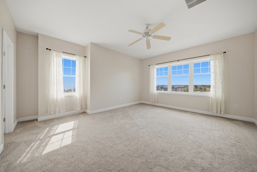 233 Beach Road, Unit A11 Salisbury, MA 01952 - Photo 23 of 37 a view of an empty room with a window