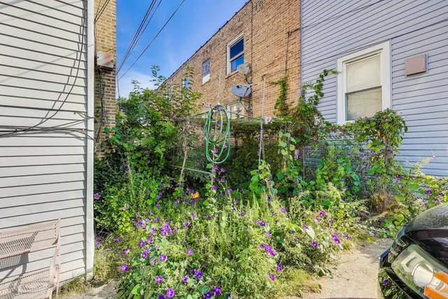a view of cars parked in front of a house