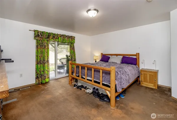 a bed room with a bed and television