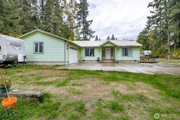 a front view of house with yard and green space
