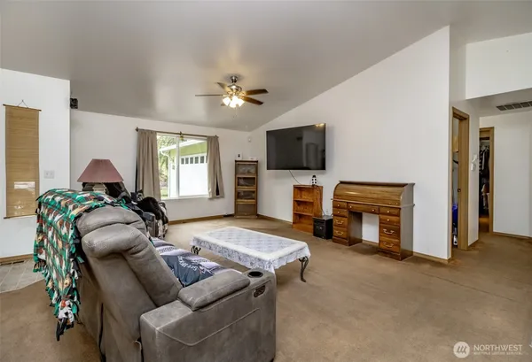 a kitchen with refrigerator and cabinets