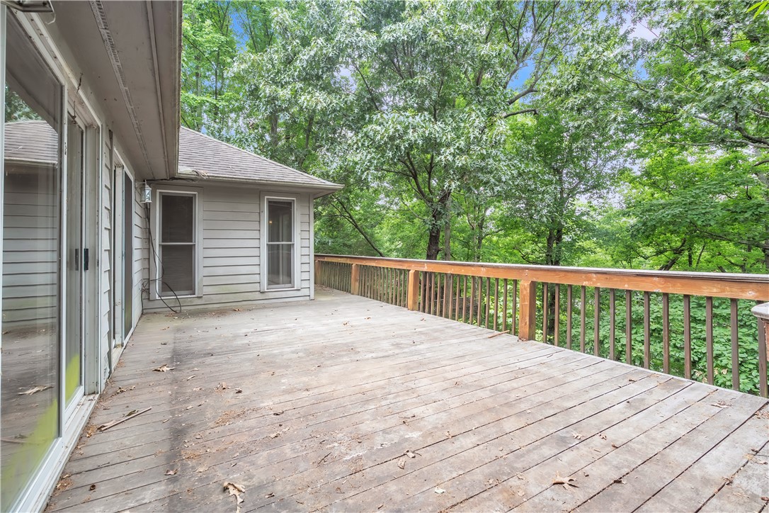 149 Inlet Pointe Drive Anderson, SC 29625 - Photo 31 of 43 An inviting deck offers serene tree views, perfect for outdoor relaxation.