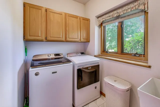 a view of storage and utility room with washer and dryer