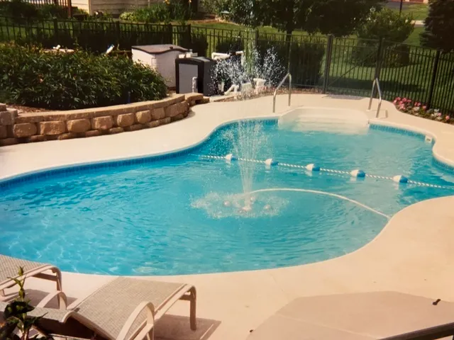 a view of a swimming pool with a patio