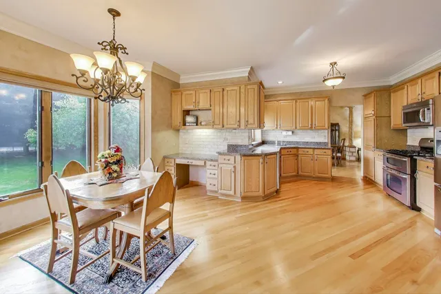 a view of a dining room with furniture window and outside view
