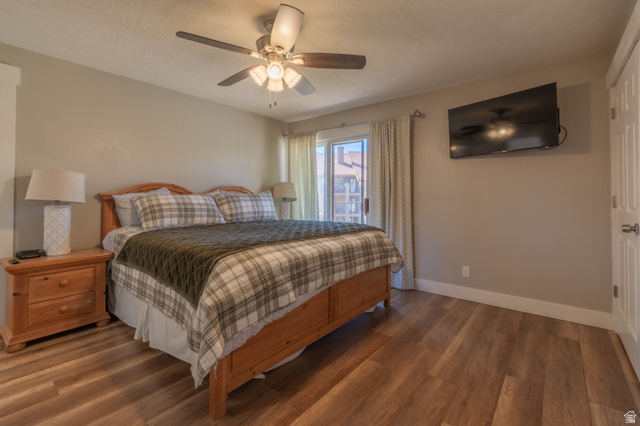860 South Village Road, Unit Y8 St. George, UT 84770 - Photo 6 of 29 Bedroom featuring wood finished floors and a ceiling fan