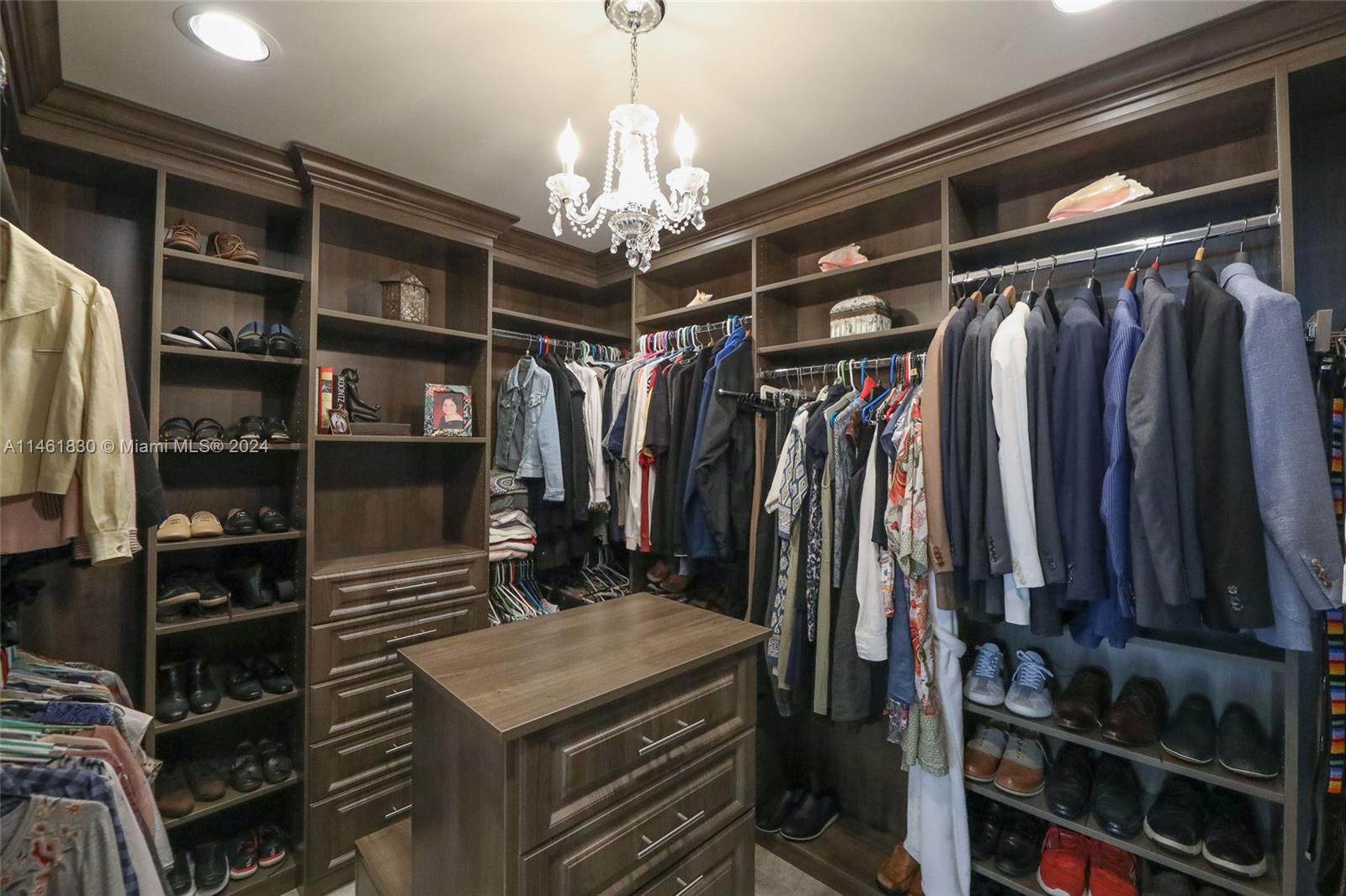 4300 Casper Court Hollywood, FL 33021 - Photo 14 of 24 a view of walk in closet with clothes and shoes