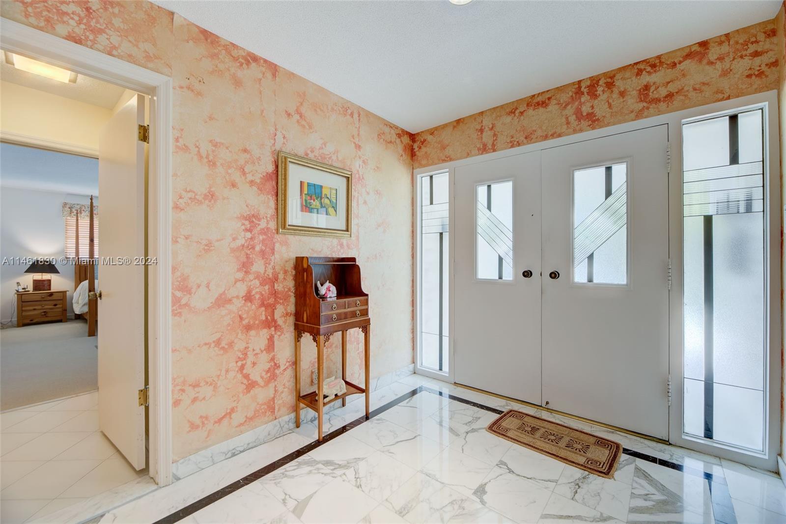 4300 Casper Court Hollywood, FL 33021 - Photo 19 of 24 a view of a livingroom with wooden floor and a hallway