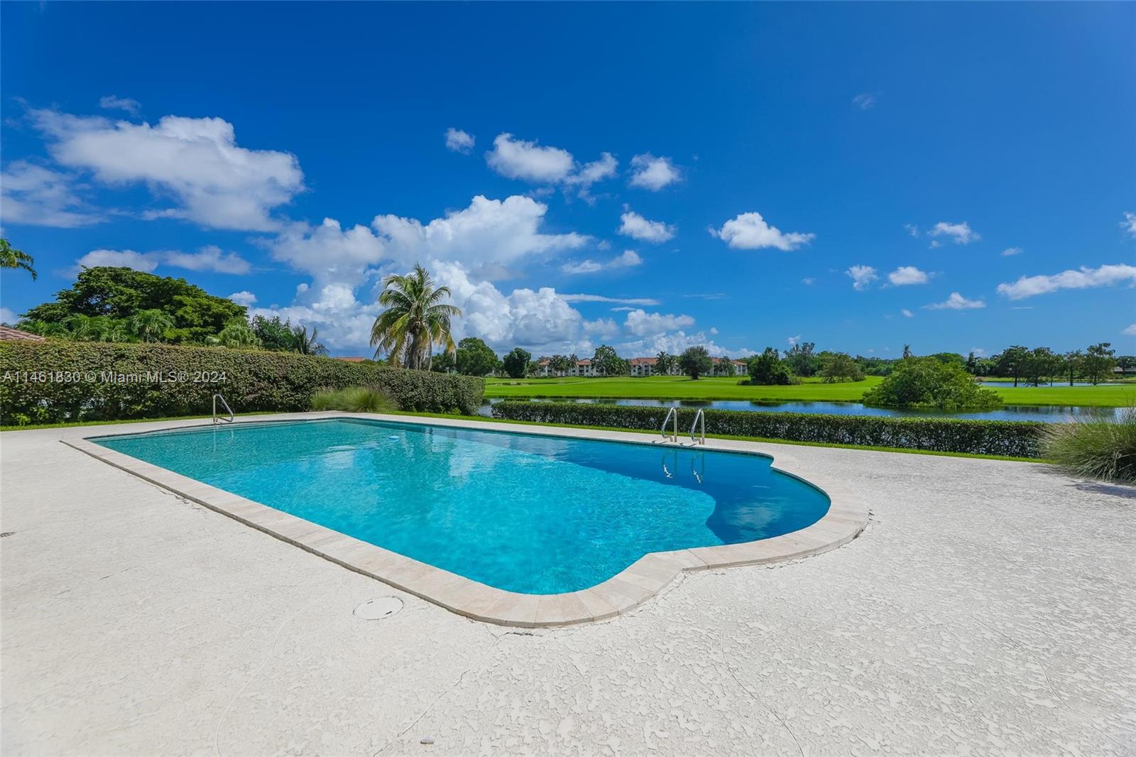 4300 Casper Court Hollywood, FL 33021 - Photo 20 of 24 a view of a swimming pool and a yard