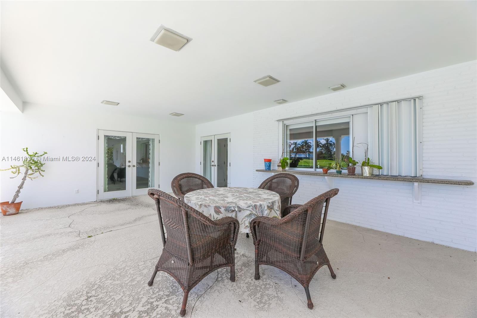 4300 Casper Court Hollywood, FL 33021 - Photo 22 of 24 a dining room with furniture and a window