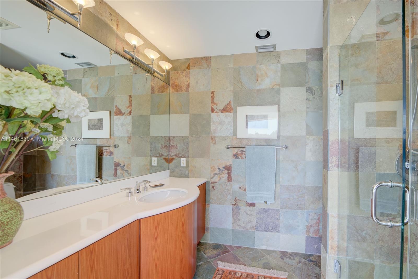 4300 Casper Court Hollywood, FL 33021 - Photo 24 of 24 a bathroom with a sink mirror and shower