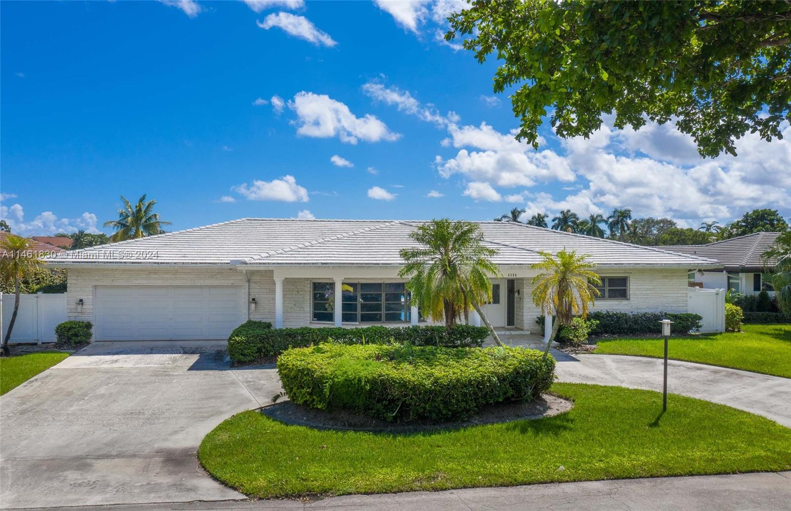 4300 Casper Court Hollywood, FL 33021 - Photo 3 of 24 a front view of a house with a yard