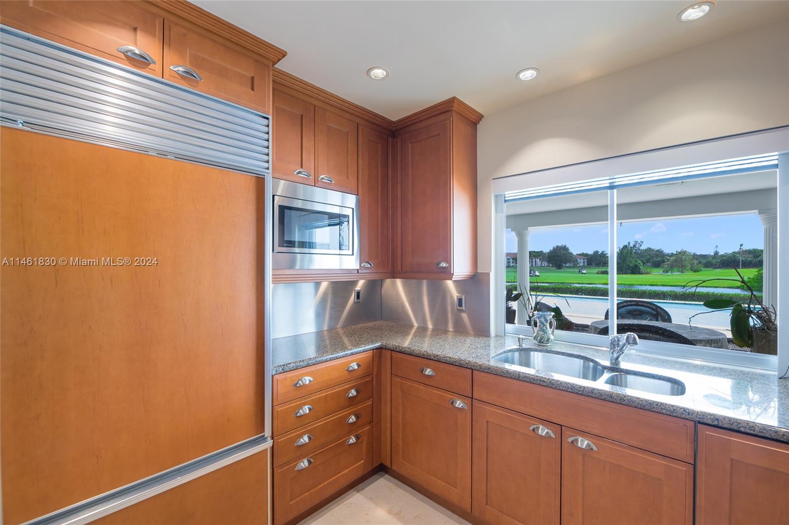 4300 Casper Court Hollywood, FL 33021 - Photo 10 of 24 a kitchen with sink and large window