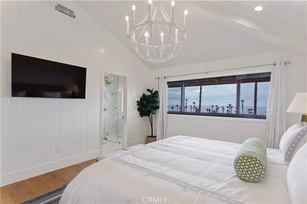 a bathroom with a granite countertop sink mirror and shower