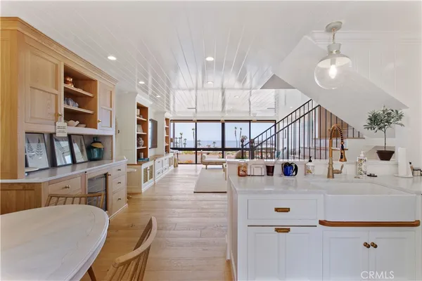 a living room with lots of furniture and a large window