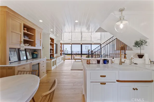 a living room with lots of furniture and a large window