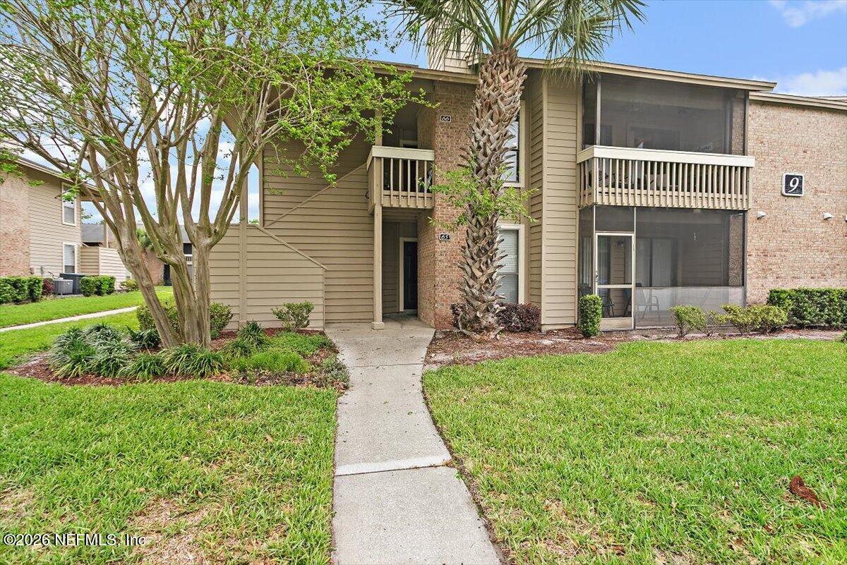 front view of a house with a yard