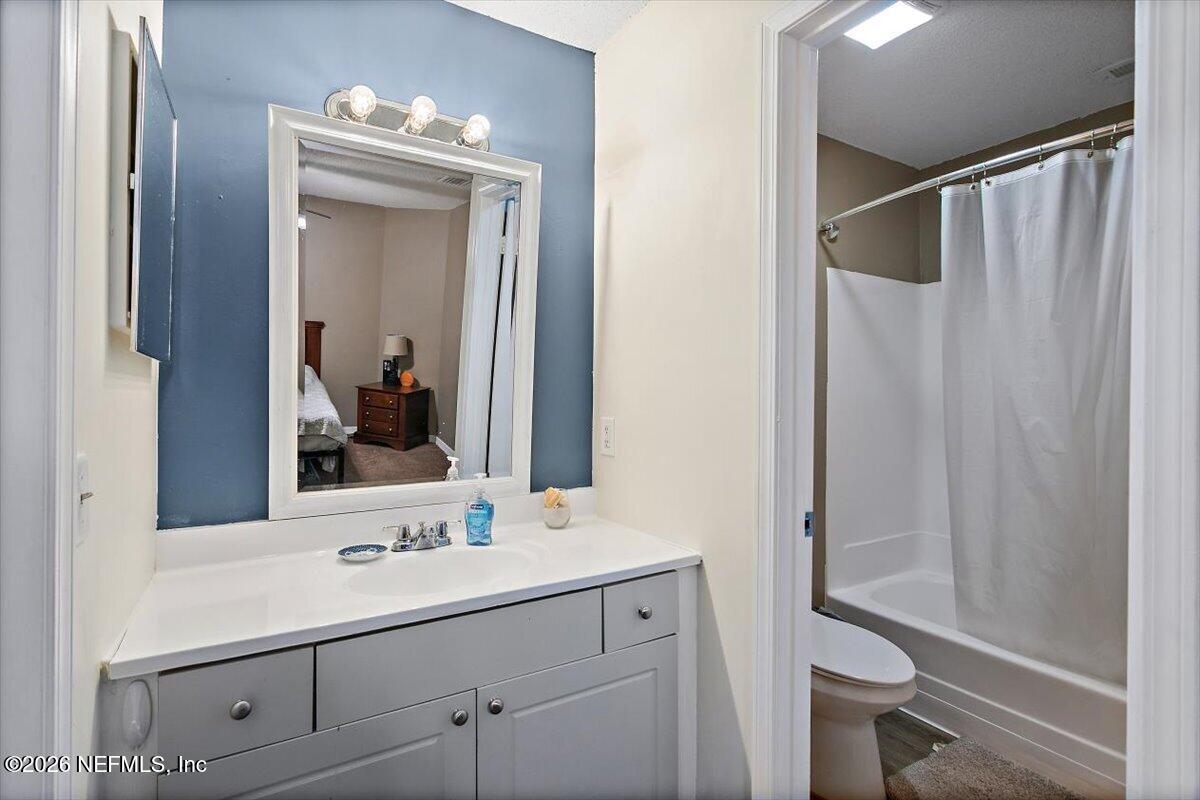 10200 Belle Rive Boulevard, Unit 66 Jacksonville, FL 32256 - Photo 11 of 18 a bathroom with a sink and a mirror