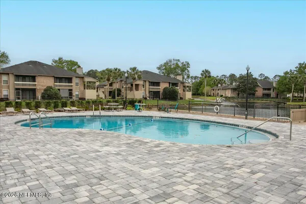a view of a swimming pool and outdoor space