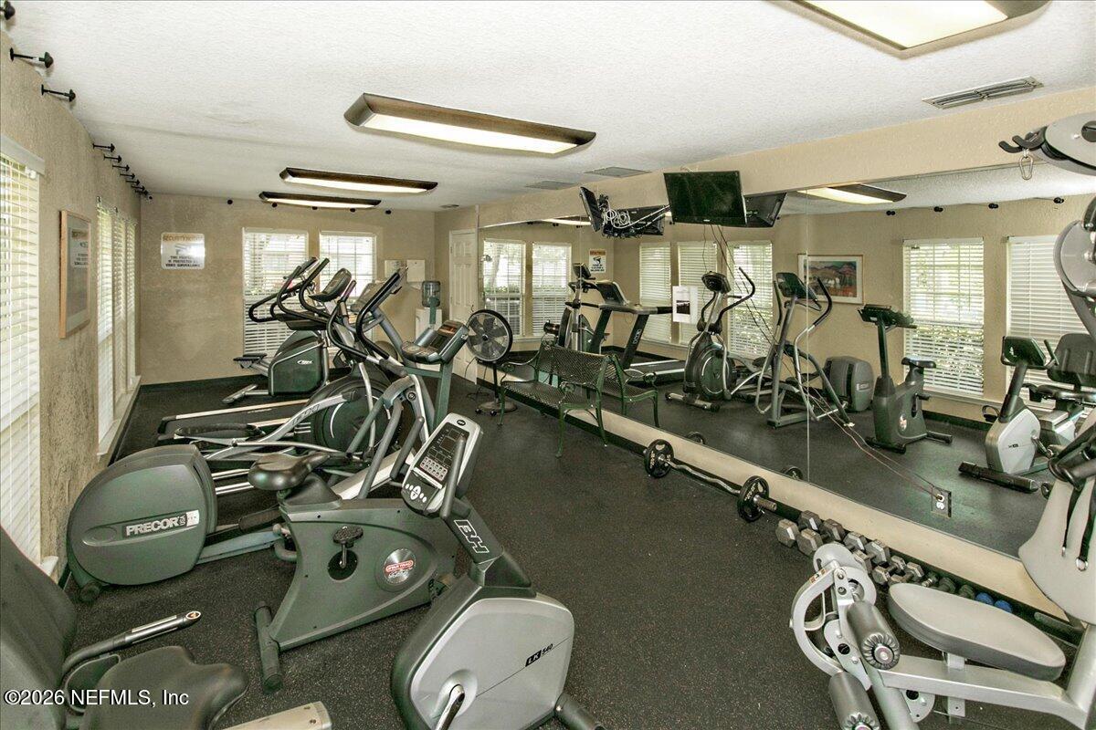 10200 Belle Rive Boulevard, Unit 66 Jacksonville, FL 32256 - Photo 16 of 18 a view of a room with gym equipment
