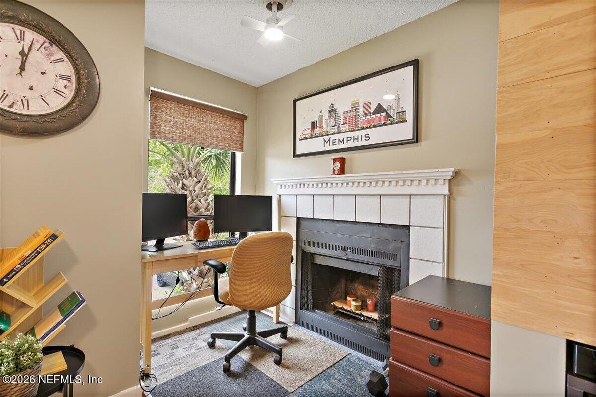 10200 Belle Rive Boulevard, Unit 66 Jacksonville, FL 32256 - Photo 7 of 18 a view of a livingroom with furniture and a fireplace