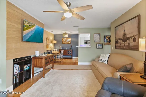 a living room with furniture and a flat screen tv