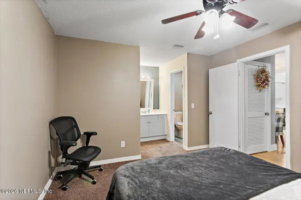 a bedroom with a workspace
