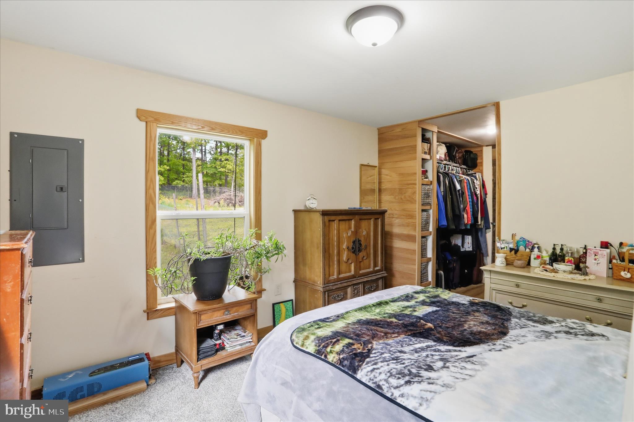 936 Johnny Cake Road Great Cacapon, WV 25422 - Photo 12 of 33 a bed room with a bed and a window