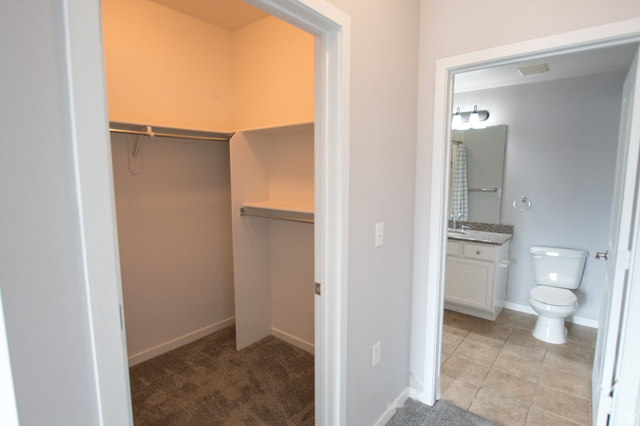 2150 South Main Street, Unit R405 Salt Lake City, UT 84115 - Photo 16 of 20 Walk-in closet featuring carpet flooring, built-in shelving, and hanging rods