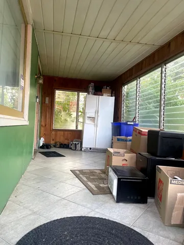 a living room with furniture windows and a fireplace