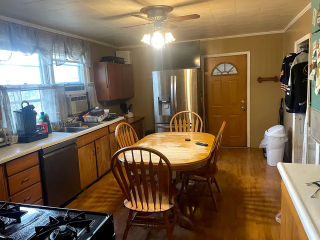 a dining room with furniture and window