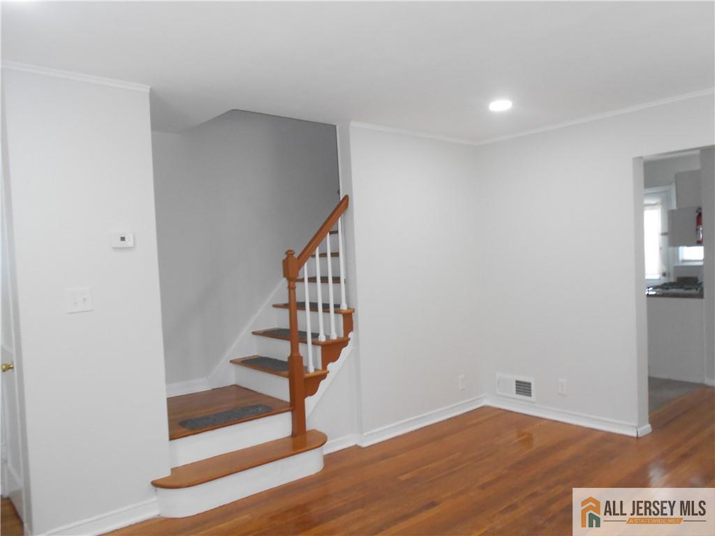 431 Crows Mill Road Fords, NJ 08863 - Photo 5 of 20 a view of entryway with stairs and wooden floor