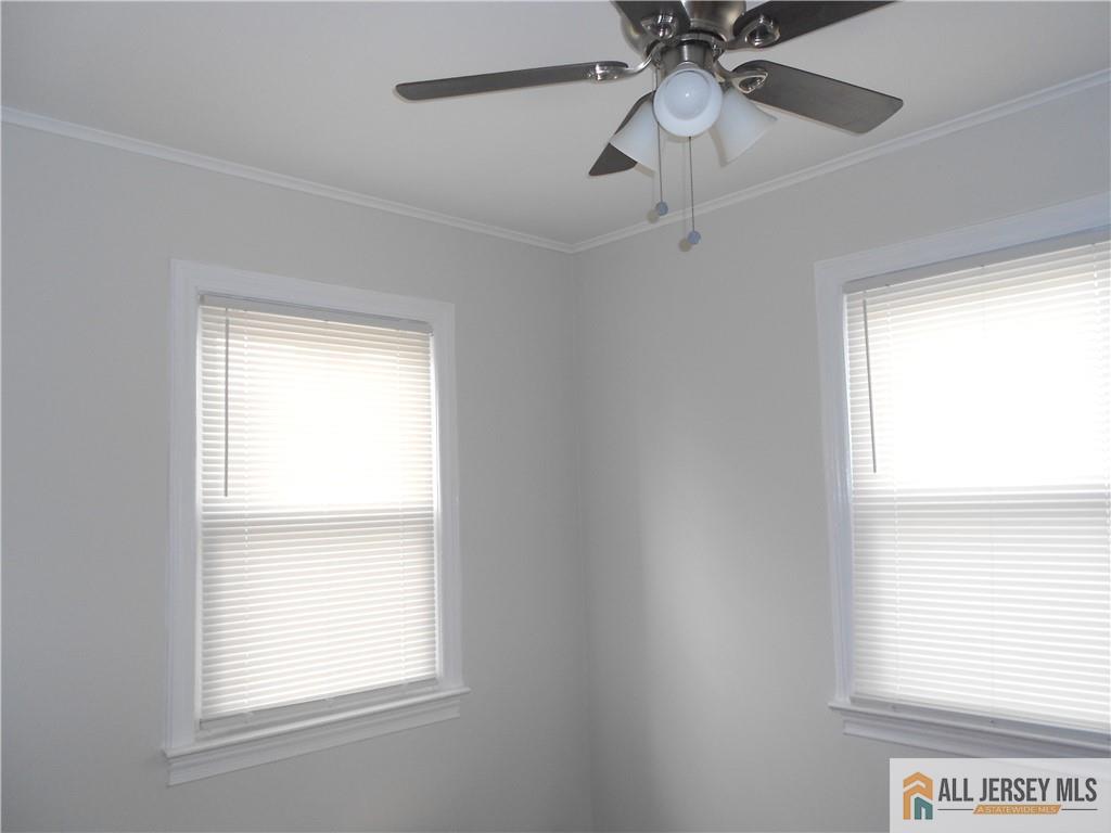 431 Crows Mill Road Fords, NJ 08863 - Photo 6 of 20 a view of an empty room with a window