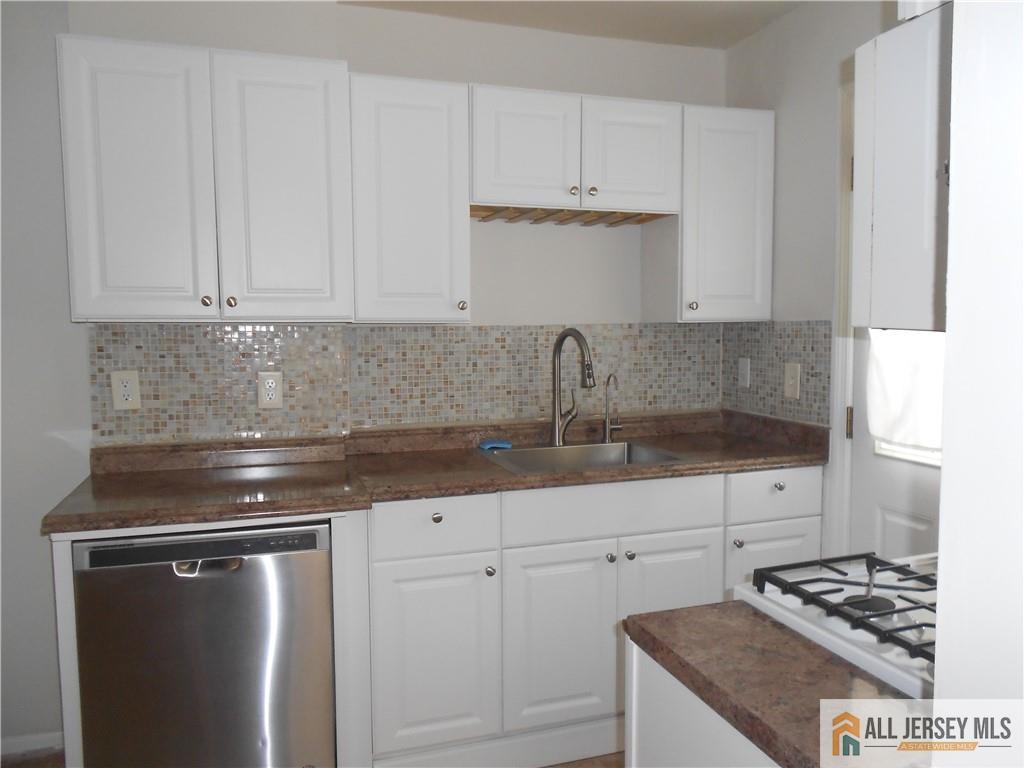 431 Crows Mill Road Fords, NJ 08863 - Photo 8 of 20 a kitchen with stainless steel appliances granite countertop a sink stove and cabinets