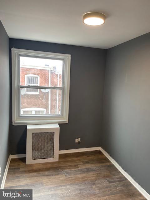 7117 Atlantic Avenue Upper Darby, PA 19082 - Photo 13 of 17 an empty room with wooden floor and windows