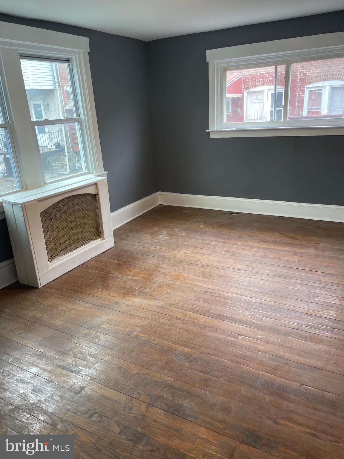 7117 Atlantic Avenue Upper Darby, PA 19082 - Photo 4 of 17 a view of empty room with window and fireplace