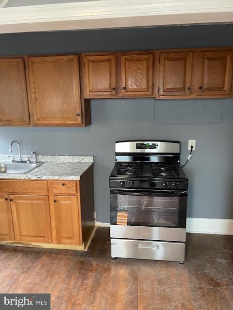7117 Atlantic Avenue Upper Darby, PA 19082 - Photo 5 of 17 a stove top oven sitting inside of a kitchen