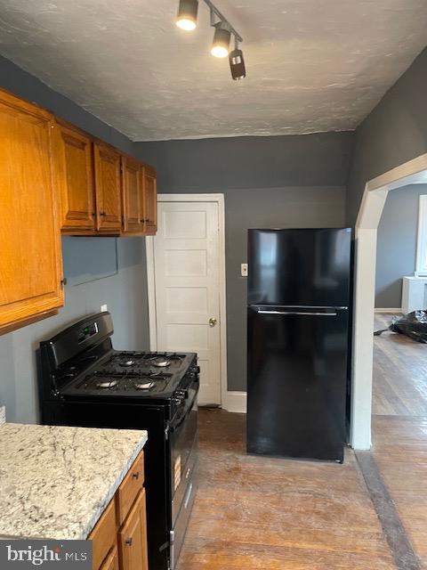 7117 Atlantic Avenue Upper Darby, PA 19082 - Photo 6 of 17 a kitchen with a refrigerator and a stove