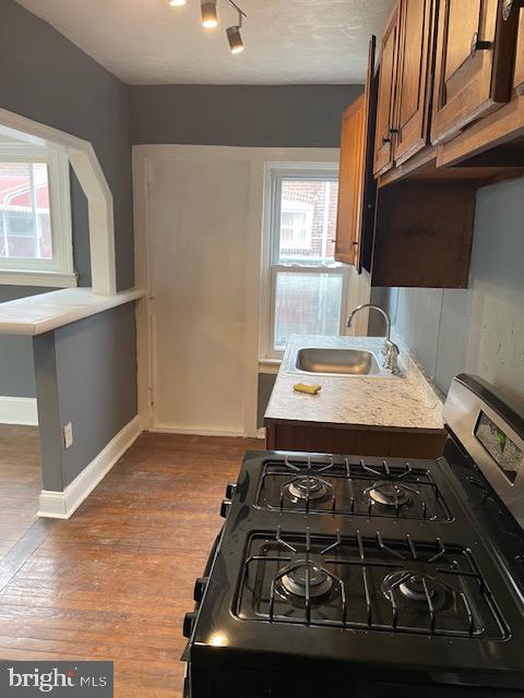 7117 Atlantic Avenue Upper Darby, PA 19082 - Photo 10 of 17 a kitchen with a stove and a microwave