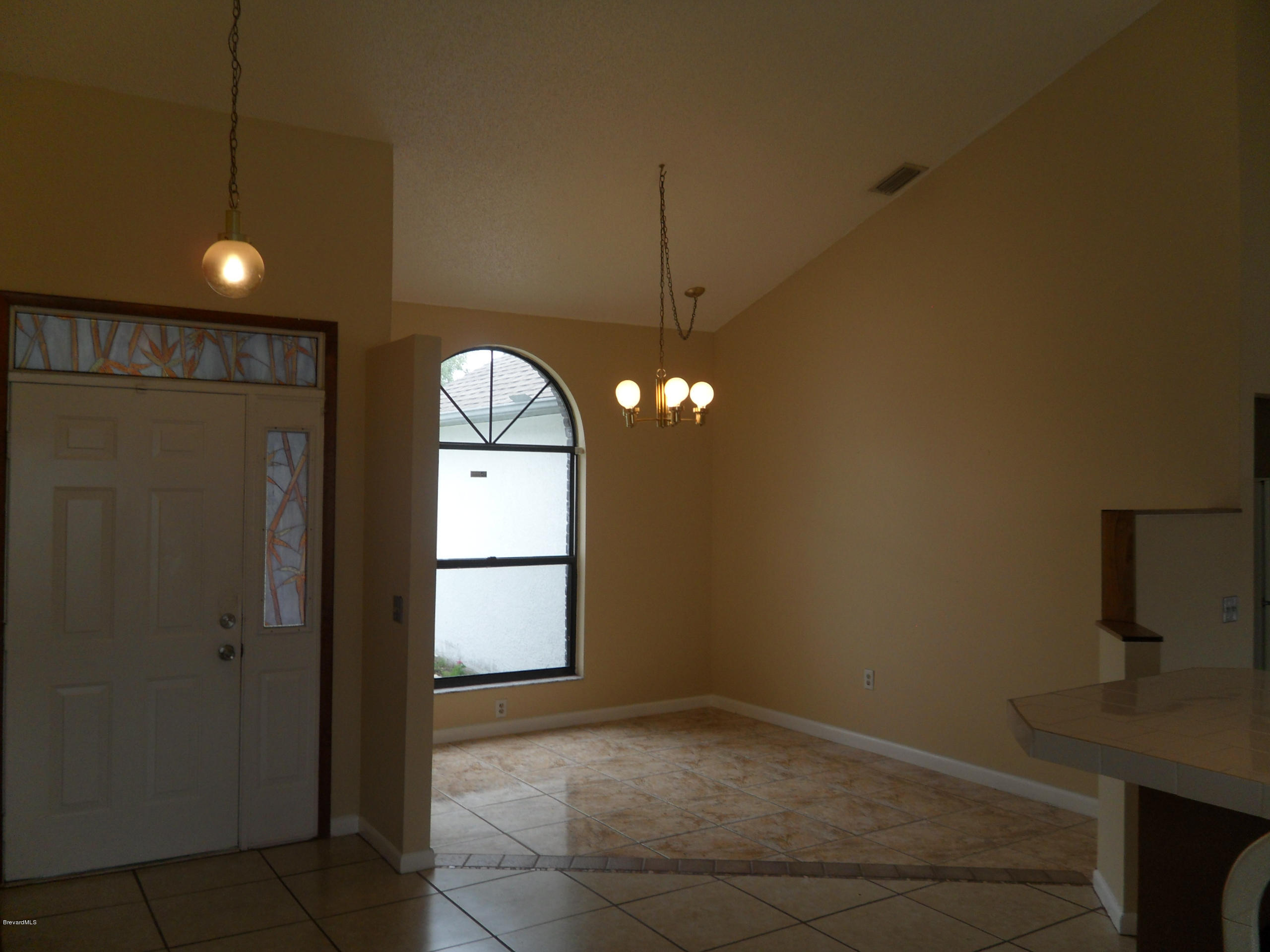 1836 Longleaf Road Cocoa, FL 32926 - Photo 22 of 49 Front Door and Dining Area