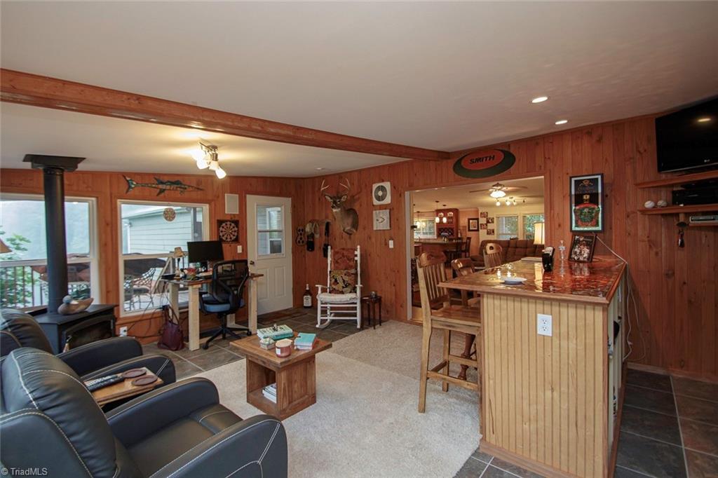 44 Nelson Loop Spencer, VA 24165 - Photo 15 of 50 Sunroom with bar and woodstove.