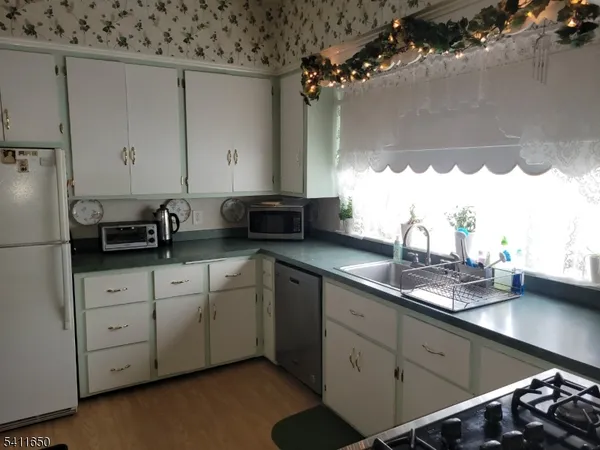 a kitchen with a sink and cabinets
