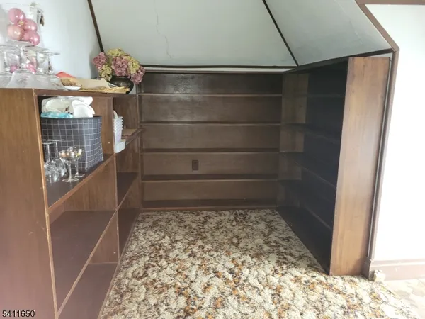 a room with water heater and wooden floor