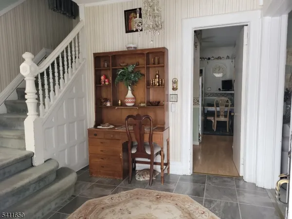 a view of livingroom with furniture and staircase