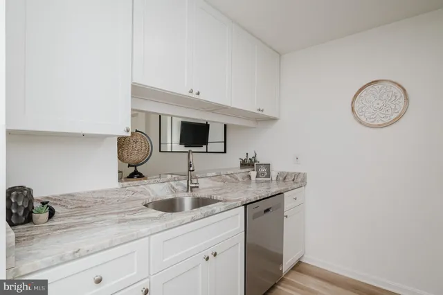 a kitchen with a sink and a stove