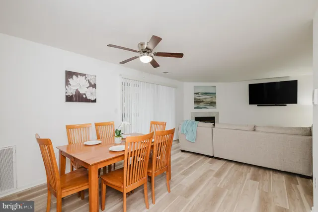 a view of a livingroom with furniture and a flat screen tv
