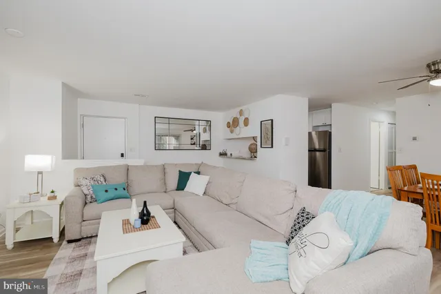 a living room with furniture and white walls