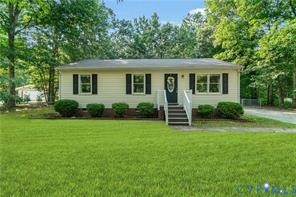 337 Corann Drive Aylett, VA 23009 - Photo 1 of 5 a view of a house with a backyard