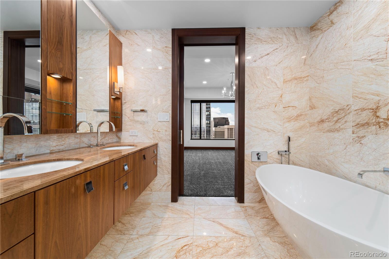 1133 14th Street, Unit 2620 Denver, CO 80202 - Photo 20 of 43 a spacious bathroom with a tub sink and mirror